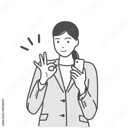 スマホを片手に持ちオーケーポーズをするスーツ姿の笑顔の女性のベクターイラスト素材　モノクロ、白バック、背景なし	