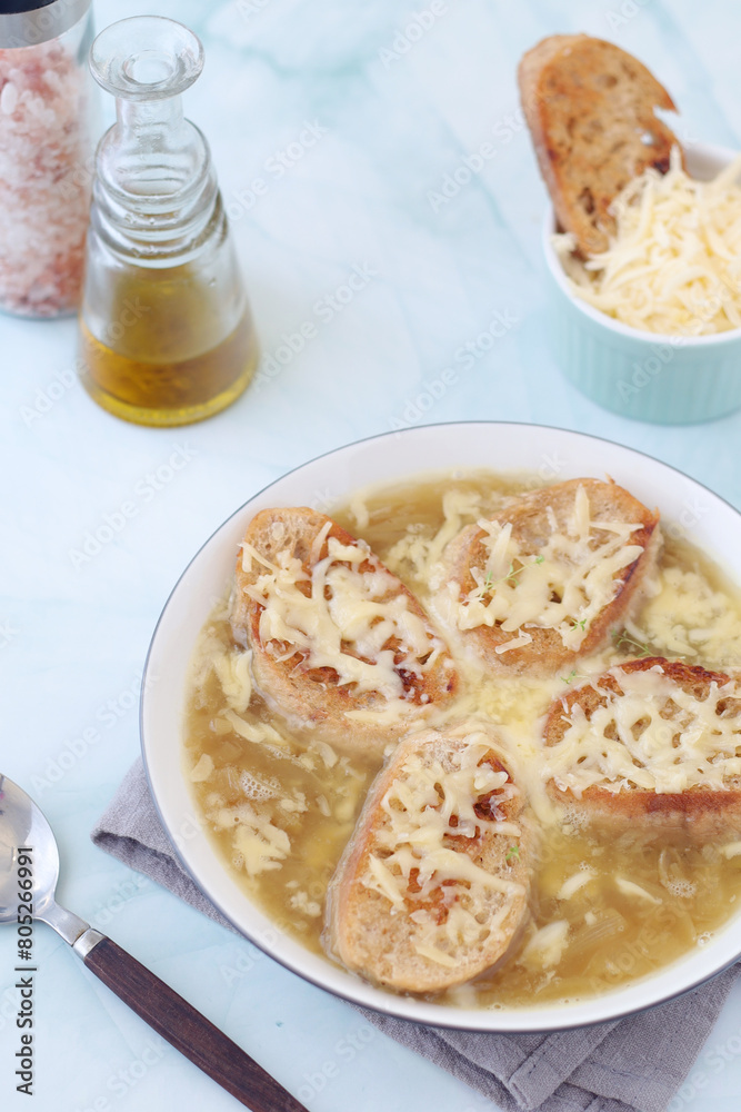 A ceramic bowl with French onion soup A ceramic bowl with French onion soup