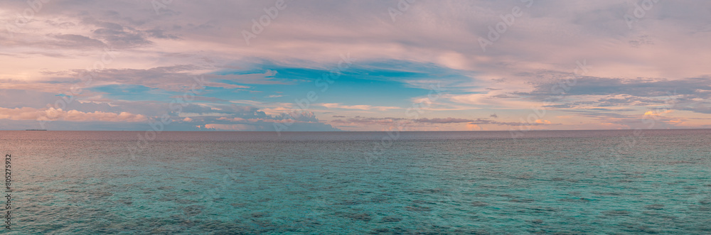 Fototapeta premium Panoramic sea skyline beach. Amazing sunrise beach landscape. Panorama of tropical beach seascape horizon. Abstract colorful sunset sky light tranquil relax summer seascape freedom wide angle seascape