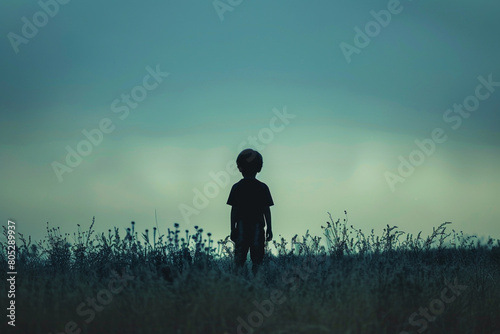 The silhouette of a child standing alone in a vast  empty space  representing the feeling of being lost and unnoticed  