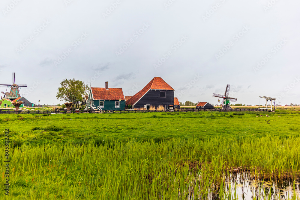 Old houses, wooden boats and farms in the picturesque village of Zaanse Schans in the Netherlands