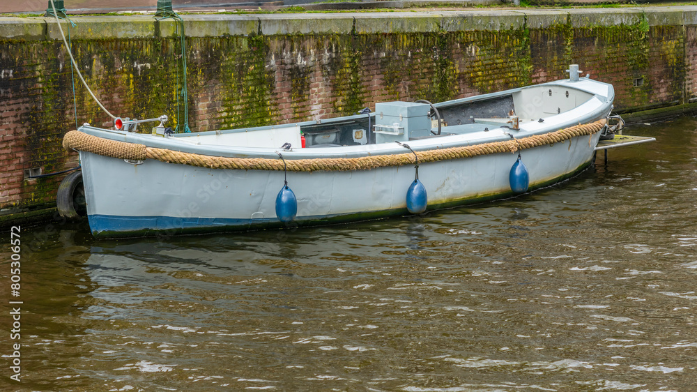 A boat on the Singel Canal in Amsterdam in spring