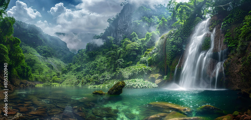 The dynamic energy of a thunderous waterfall plunging into a serene pool, surrounded by the dense greenery of a tropical jungle. The panorama captures both the power 