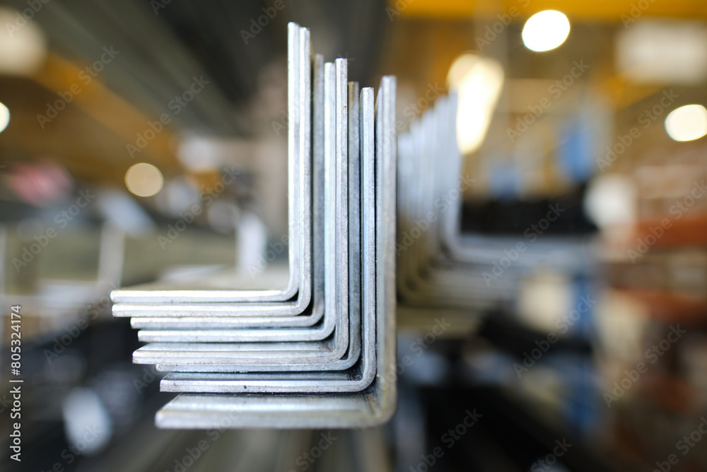 Metal steel square piping pipes stacked up on an industrial heavy duty ...