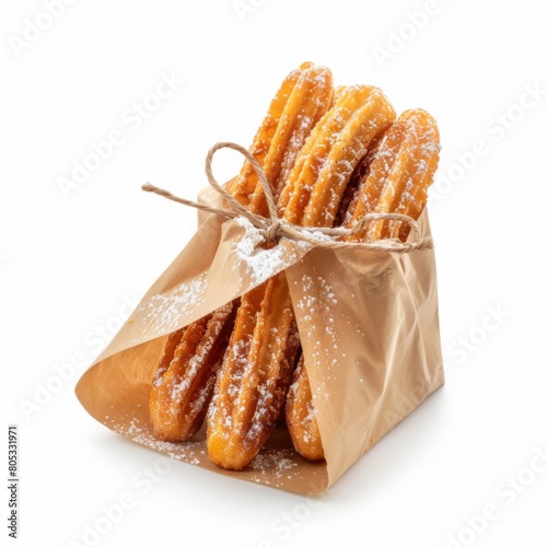 A bag of churros topped with powdered sugar, ready to indulge photo