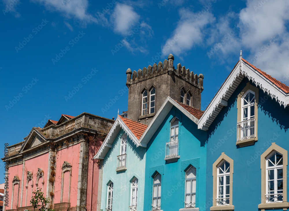 colored house and tower of The Cathedral of Braga, Portugal