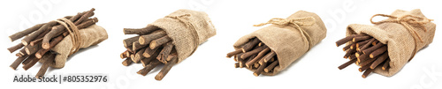 Burlap bags full of licorice sticks on transparent background. Four rustic burlap sacks are filled with dry licorice sticks, isolated on a transparent background  photo