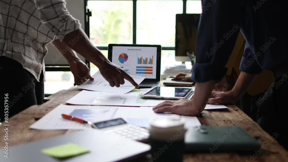 Financial advisor meeting is discussing analysis of business growth chart and market situation and financial planning.