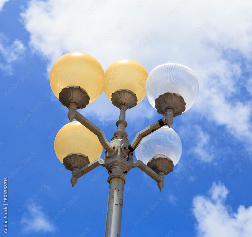 Modern round street lamps against blue sky Modern round street lamps against blue sky