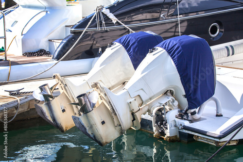 Outboard engines with cover on the boat