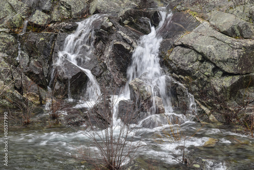  water  flowing over the rocks of the  spillway photo