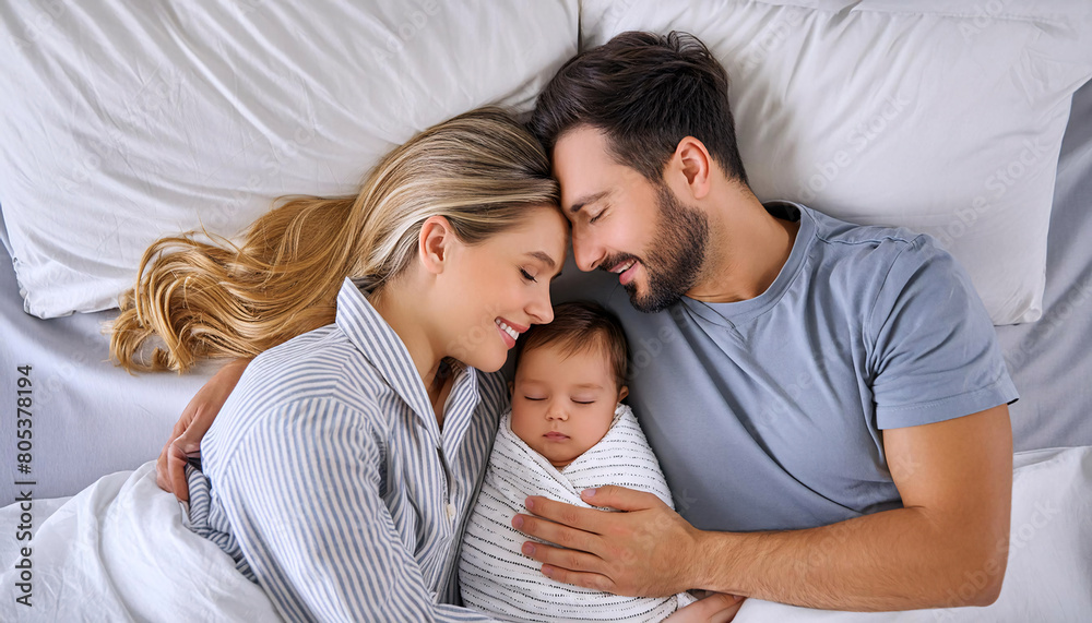 A serene portrait of parents with their happy, peaceful, and calm baby A serene portrait of parents with their happy, peaceful, and calm baby