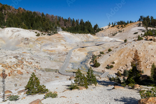 a beautiful hiking path through the Bumpass hell valley in the lassen volcanic national park, california photo