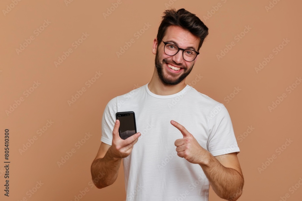 Man showing smartphone, hand pointing banner, clever thought, quote pointing finger on light brown Man showing smartphone, hand pointing banner, clever thought, quote pointing finger on light brown