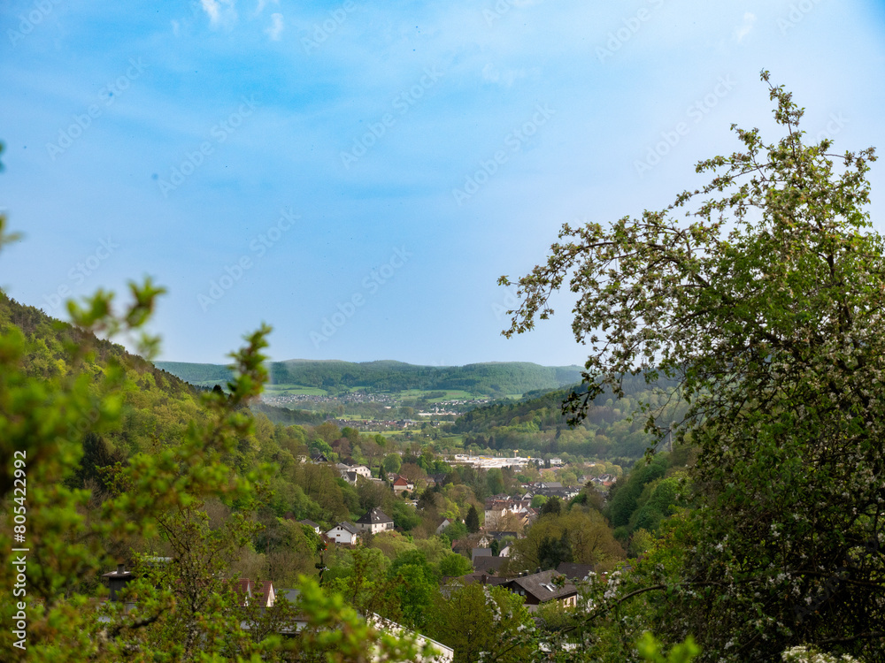 Shot goes down into a valley, where you can see various houses and various villages within the valley Shot goes down into a valley, where you can see various houses and various villages within the valley
