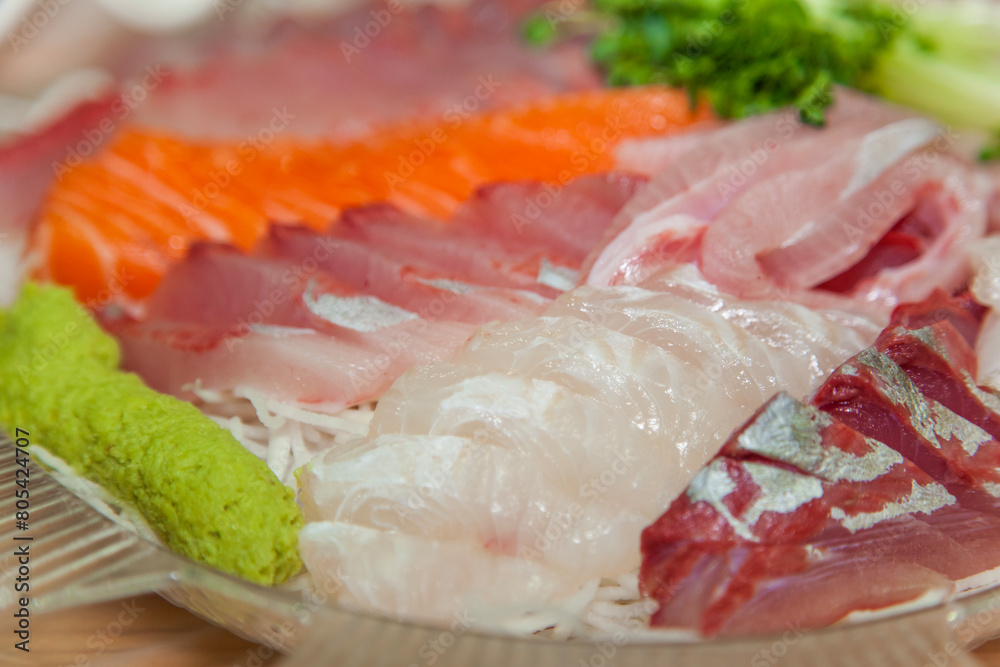 The sashimi of yellowtail and salmon on the dish The sashimi of yellowtail and salmon on the dish
