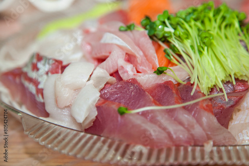 The sashimi of yellowtail and salmon on the dish