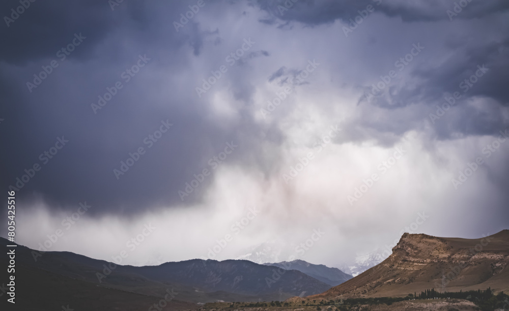 Cloudy rainy weather with clouds in the mountains, heavy rain and water pouring from the sky, rainy atmosphere Cloudy rainy weather with clouds in the mountains, heavy rain and water pouring from the sky, rainy atmosphere