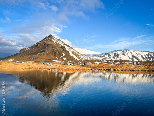 View of Snæfellsjökull volcano and the town of Arnarstapi on Iceland's Snæfellsnes Peninsula