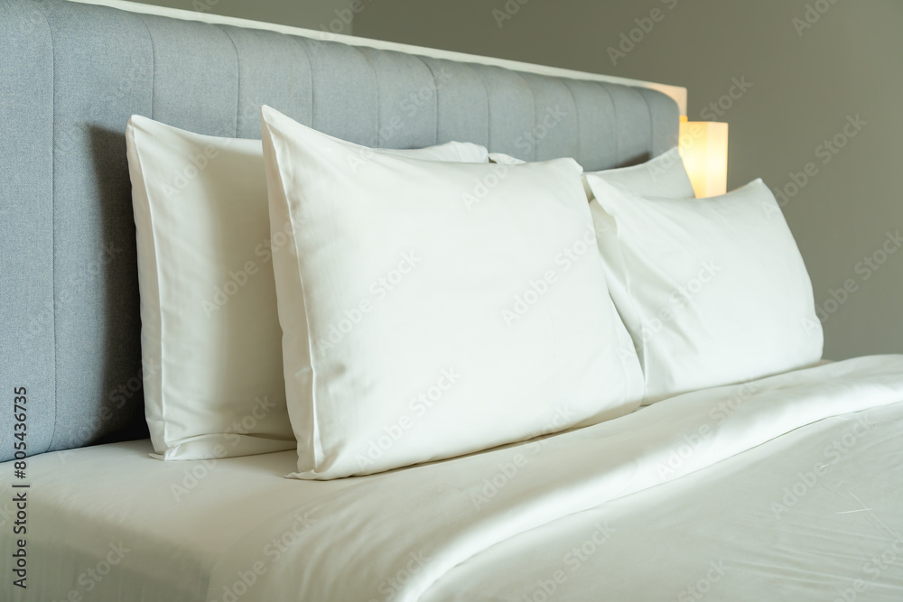 Closeup of new bed comforter with white pillows, headboard in bedroom of hetel. Closeup of new bed comforter with white pillows, headboard in bedroom of hetel.