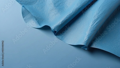 background texture of blue paper with waves and creases