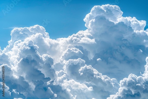 Beautiful picturesque cumulus clouds on a blue sunny sky, background