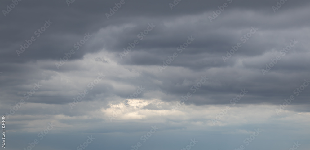 DarDark, gloomy, overcast clouds gray and white with some light peeking through DarDark, gloomy, overcast clouds gray and white with some light peeking through