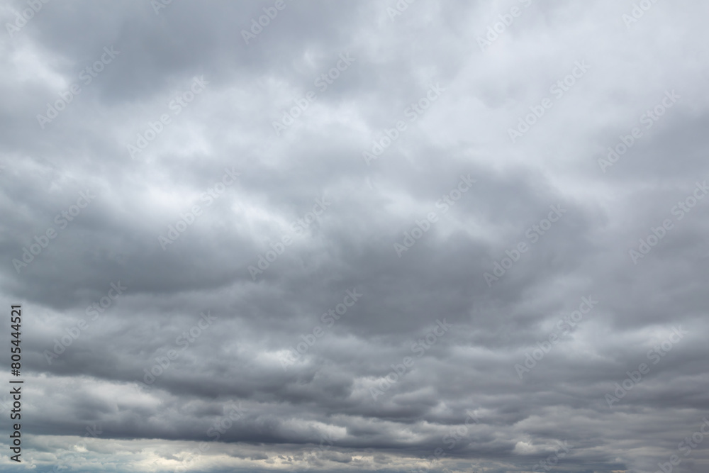 Obraz premium Dark, gloomy overcast clouds gray and white