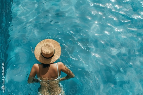 A woman chilling in the pool on a summer day.