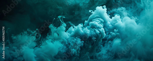 Luminous teal smoke against a dark backdrop, suggesting an underwater scene,