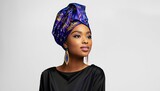 beautiful black african woman in traditional turban proudly displays her beautiful skin with make-up