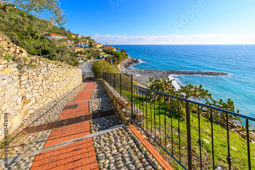 The steep pedestrian walkway from the coast to the hilltop medieval town of Cervo, Italy, in the Imperia Liguria region of the Mediterranean Sea. photo
