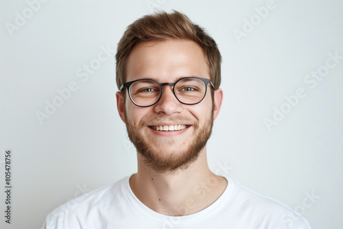 Portrait of handsome young smiling man with short hair photo