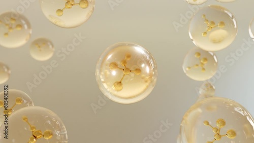 A macro shot demonstrates many water-forming bubbles on a bright background.  A molecule inside a liquid bubble. Essence Ball Molecules.
