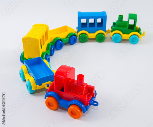 Children's train with plastic carriages on a white background.