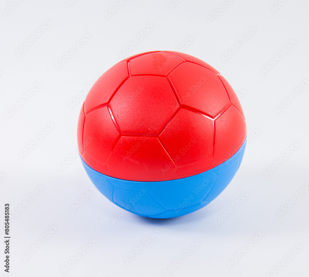 Fototapeta premium Red blue children's plastic ball on a white background.