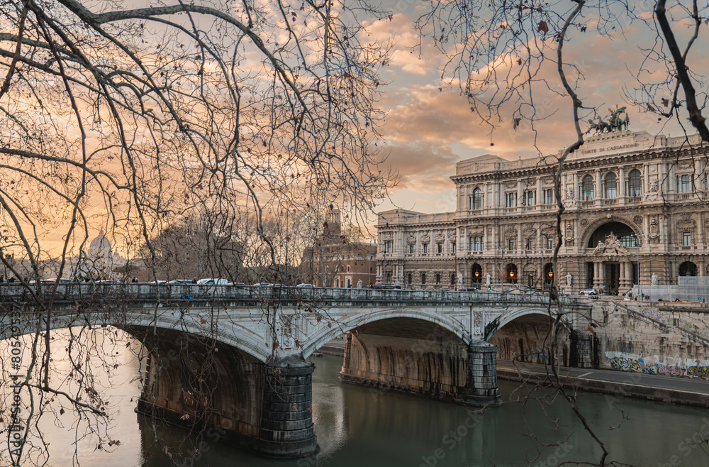 Obraz premium A majestic bridge stretches across a serene body of water, leading to a distant building emerging from the horizon. The bridge symbolizes connection and passage between realms
