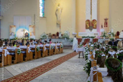 Ceremony of First Holy Communion in Catholic church photo