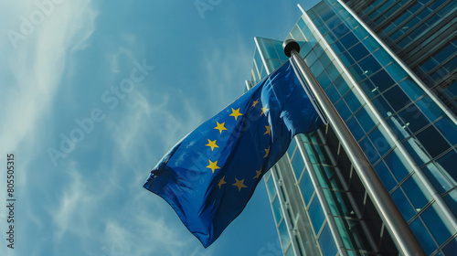 Bandiera dell'Unione Europea issata che si muove al vento photo