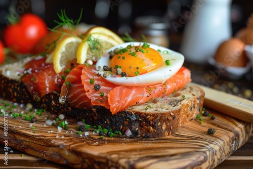 Smorrebrod Danish Sandwich with Salmon and Egg on Wooden Board. Traditional Danish Cuisine Served photo