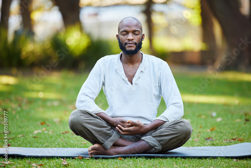 Black man, meditation and yoga in park for fitness, zen and mindfulness outdoor with health, wellness and calm. Spiritual, balance and holistic healing for aura or soul, energy and peace in nature