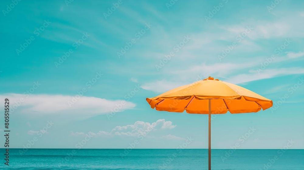 Beach umbrella in front of blue sky and sea -
