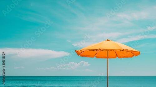 Beach umbrella in front of blue sky and sea -