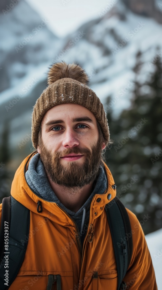 A man with a beard dressed in a yellow jacket and brown hat A man with a beard dressed in a yellow jacket and brown hat