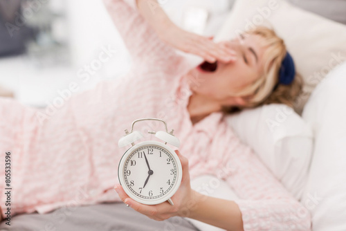 White clock and sleeping woman photo