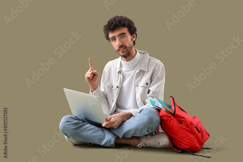 Male student with laptop po...