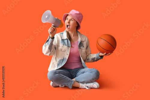 Young woman with ball shout...