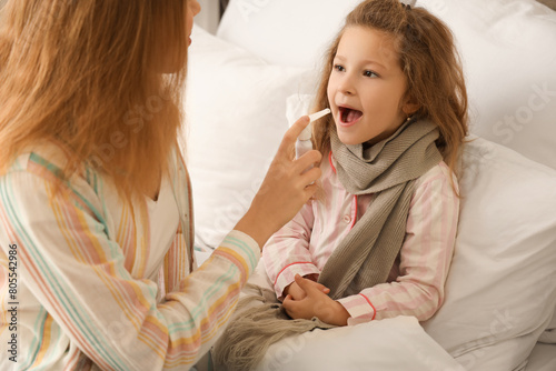 Sick little girl with her m...