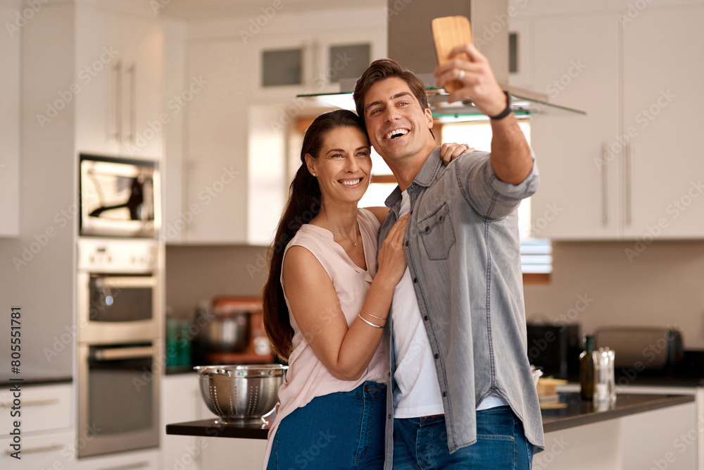 Couple, home kitchen and selfie with mobile for profile picture together, social media post and digital gallery. Apartment, woman smile and man for photo on phone with happy memory, relax and love Couple, home kitchen and selfie with mobile for profile picture together, social media post and digital gallery. Apartment, woman smile and man for photo on phone with happy memory, relax and love