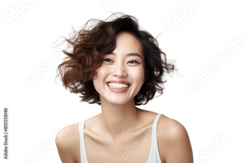 Beautiful young woman with short brown hair and a bright smile. She is wearing a white tank top and has a natural, relaxed expression on her face.